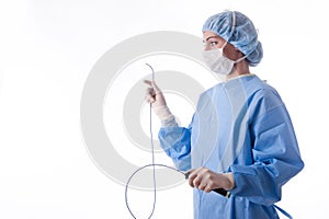 Female doctor or nurse holding a catheter