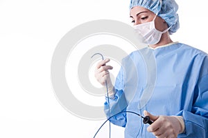 Female doctor or nurse holding a catheter photo