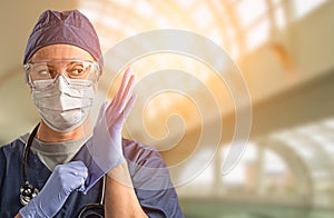 Female Doctor or Nurse Wearing Protective Face Mask and Surgical Gloves In Hospital