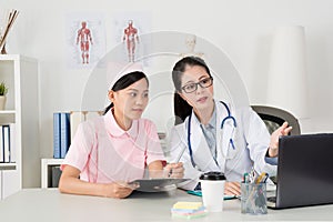 Female doctor with nurse working together