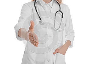 Female doctor offering handshake on white background, closeup