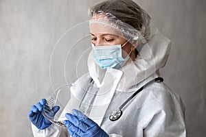 Female doctor in personal protective equipment PPE from COVID-19 coronavirus