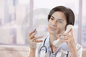 Female doctor on the phone