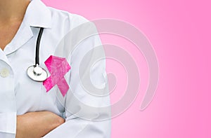 Female doctor with pink breast cancer awareness ribbon