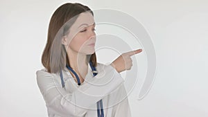 Female Doctor Pointing on Side on White Background