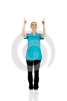 Female doctor pointing up.