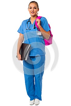 Female doctor posing with backbag