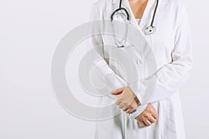 Female doctor posing confident in white medical uniform