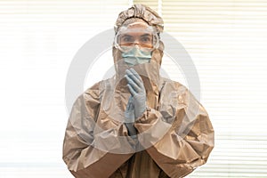 Female Doctor in PPE Personal Protective Equipment clap