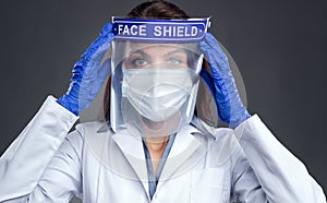 Female doctor in protective face shield