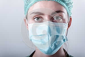 Female Doctor in Protective Mask and Medical Cap on Isolated Background, Closeup Portrait of Medicine Surgeon Doctor Wearing
