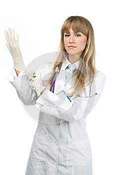 Female doctor putting on surgical glove