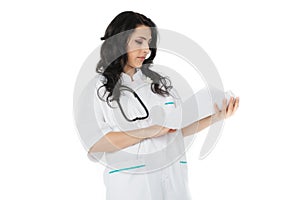 Female doctor reading papers