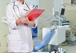 Female doctor with red clipboard