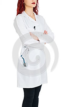 Female doctor with red hair. white background. stethoscope file and white uniform