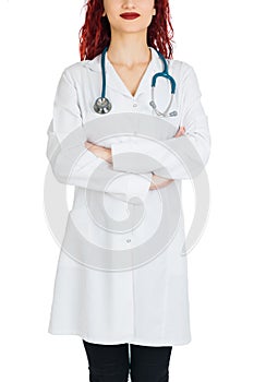 Female doctor with red hair. white background. stethoscope file and white uniform