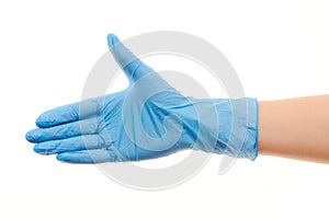 Female doctor's hand in blue surgical glove giving for handshake