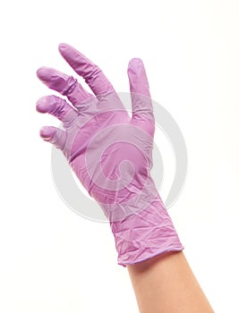 Female doctor's hand in purple sterilized surgical glove