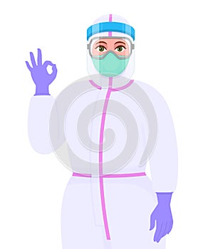 Female doctor in safety protective suit, glasses and mask showing okay, OK gesture sign. Physician gesturing success or winner