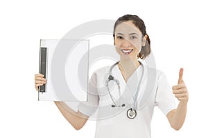 Female doctor showing blank clipboard and giving thumbs up