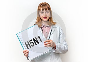 Female doctor showing clipboard with written text: H5N1