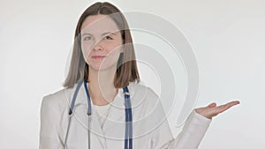 Female Doctor Showing on Side on White Background