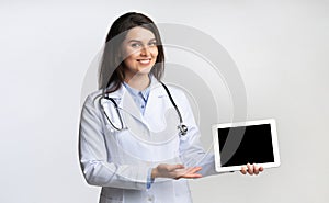 Female Doctor Showing Tablet Blank Screen, Studio Shot, Mockup