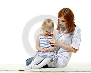 Female doctor and small patient.