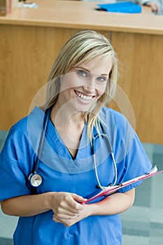 Female doctor smiling and looking at the camera