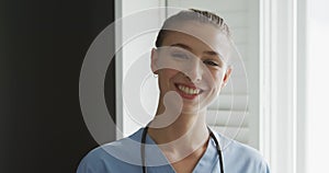 Female doctor smiling to camera