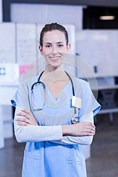 Female doctor standing with arms crossed