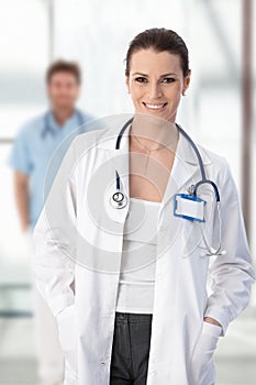 Female doctor standing with hands in pocket