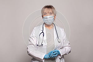 Female doctor standing ready to work. Healthcare and medicine concept