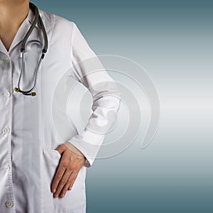 Female doctor and stethoscope on blue blurred background. Concept of Healthcare And Medicine. Copy space