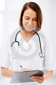 Female doctor with stethoscope and clipboard