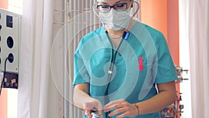 A female doctor with a stethoscope is listening to a patient`s breath