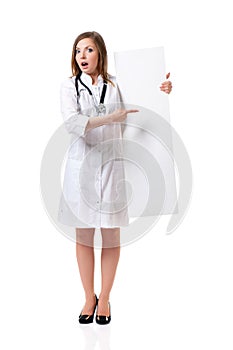 Female doctor with stethoscope showing blank