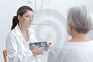 Doctor tablet computer senior patient photo