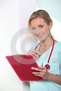 Female doctor taking notes