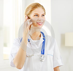 Female doctor talking on the cell phone