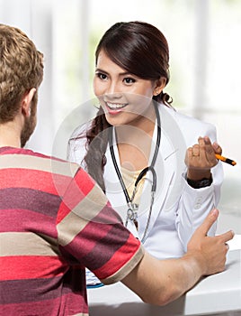 Female doctor talking to her male patient