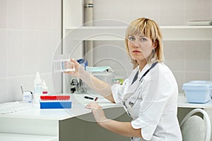 Female doctor with test tube