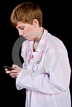 Female doctor texting on a cell phone