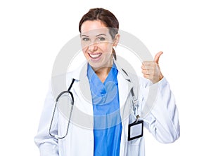 Female doctor with thumb up