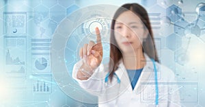 Female doctor touches a digital transparent screen in hud style