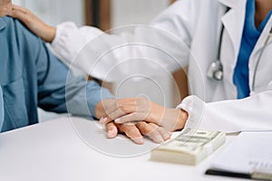 Female doctor touching patient's shoulder to encourage treatment