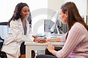 Female Doctor Treating Patient Suffering With Depression