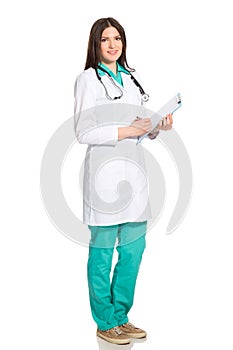 Female doctor in uniform with clipboard and stethoscope writting