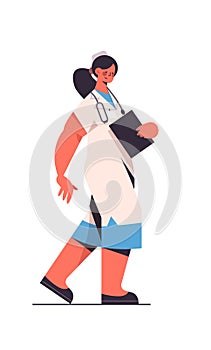 Female doctor in uniform holding clipboard healthcare medicine concept