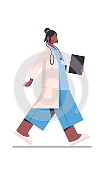 Female doctor in uniform holding clipboard healthcare medicine concept